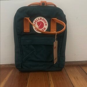 Kånken Mini Dark Green Backpack with Orange Handles